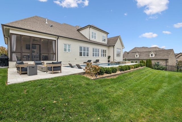 back of property with a fenced in pool, a yard, a patio area, and a sunroom