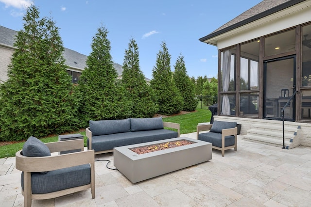 view of patio featuring an outdoor living space with a fire pit