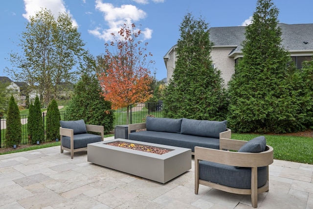 view of patio / terrace with an outdoor living space with a fire pit