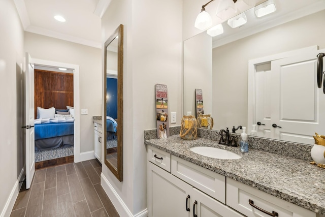 bathroom with vanity and ornamental molding