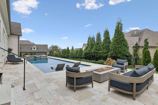 view of swimming pool with a fire pit, a patio area, and an in ground hot tub