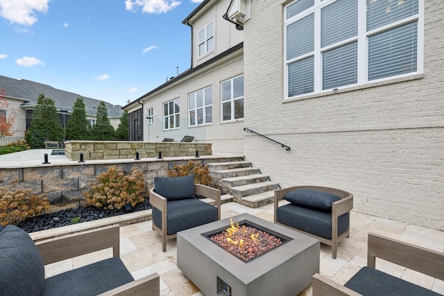 view of patio / terrace with a fire pit