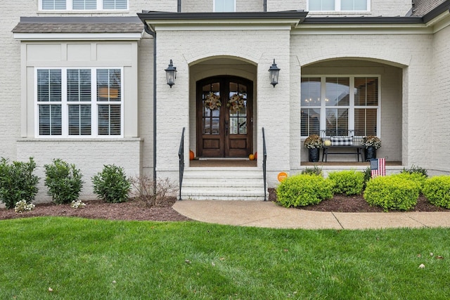 doorway to property with a yard