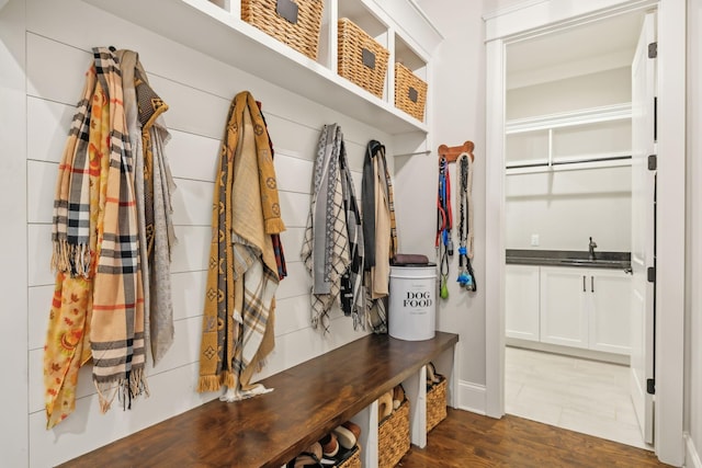 mudroom featuring dark wood-type flooring and sink