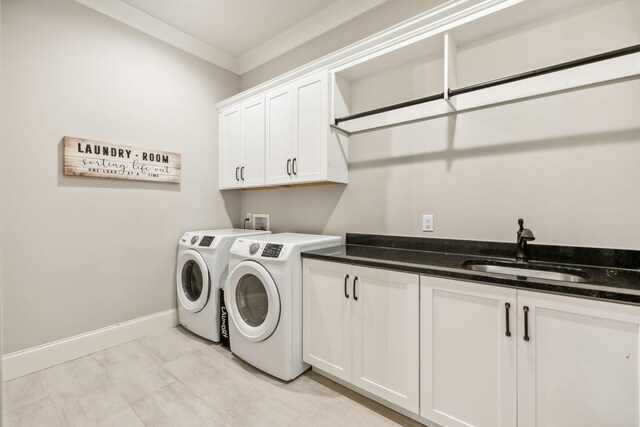 washroom featuring independent washer and dryer, cabinets, ornamental molding, and sink