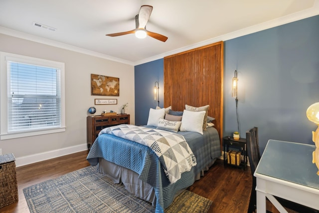 bedroom featuring ornamental molding, dark wood-type flooring, and ceiling fan