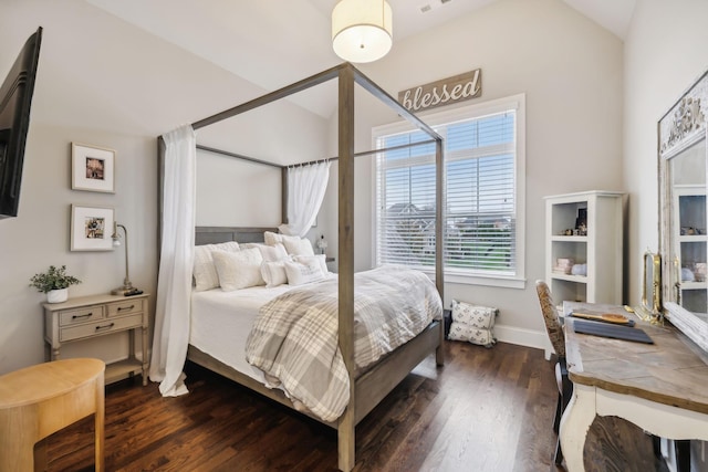 bedroom with dark hardwood / wood-style flooring