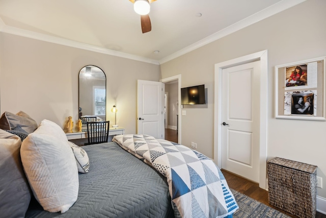 bedroom featuring dark hardwood / wood-style flooring, crown molding, and ceiling fan