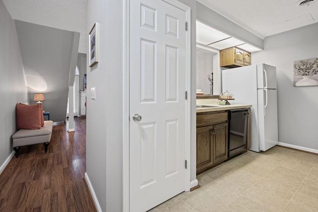 interior space featuring crown molding and light hardwood / wood-style flooring