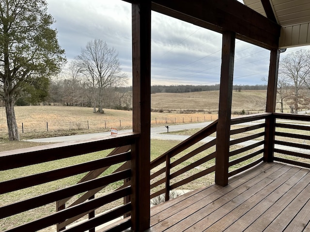 wooden terrace featuring a rural view