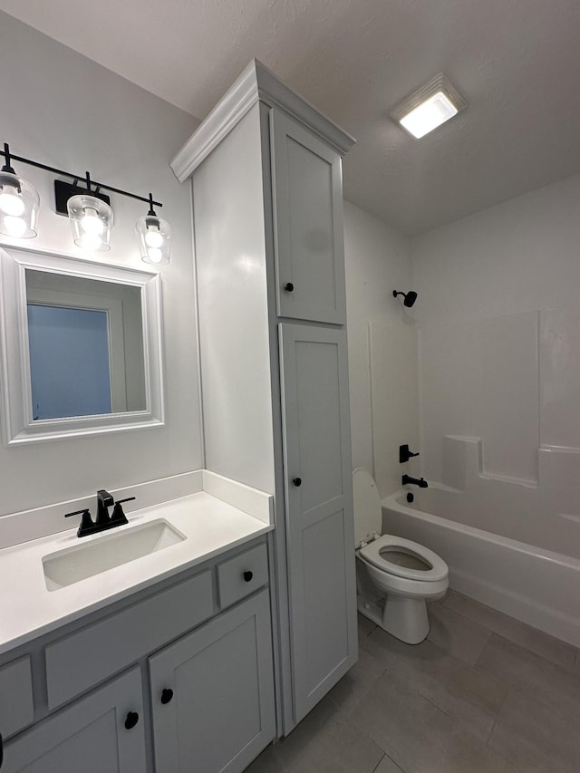 bathroom with shower / bath combination, vanity, and toilet