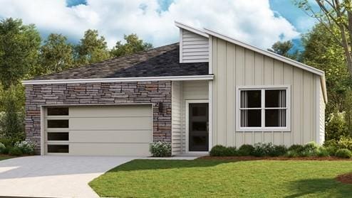 view of front of house featuring a garage and a front lawn