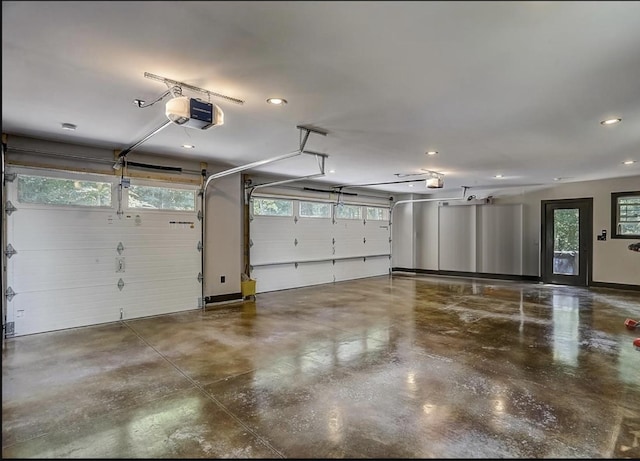 garage featuring recessed lighting and a garage door opener