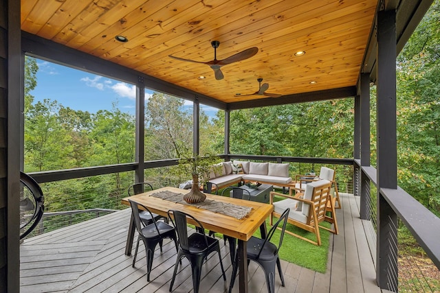 sunroom featuring wooden ceiling, plenty of natural light, and ceiling fan