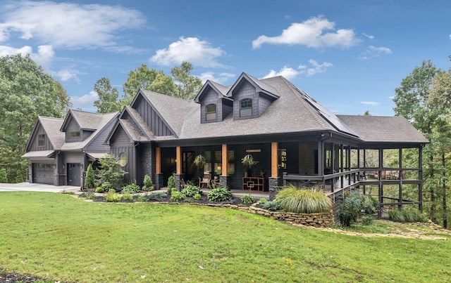 view of front of property featuring a garage and a front lawn