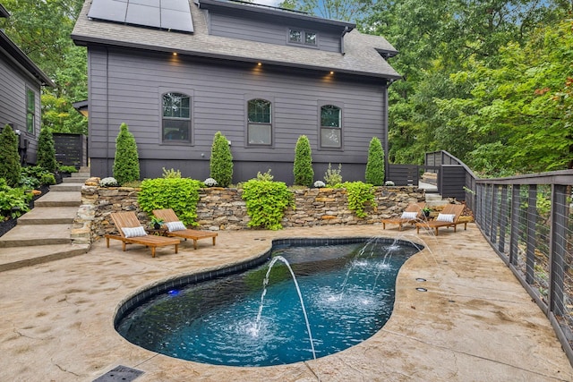 pool with stairway and a patio area