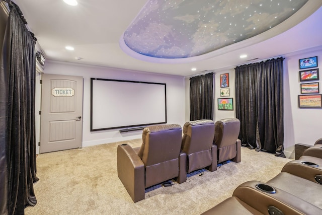 cinema room featuring recessed lighting, a raised ceiling, and light colored carpet