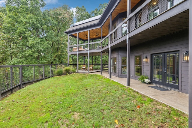 view of yard with french doors and a patio area