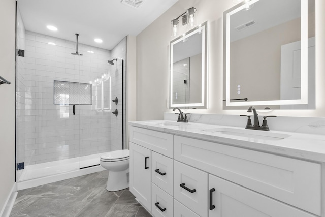 bathroom featuring toilet, a stall shower, visible vents, and a sink