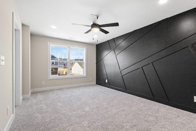 unfurnished bedroom featuring baseboards, recessed lighting, a ceiling fan, and light colored carpet