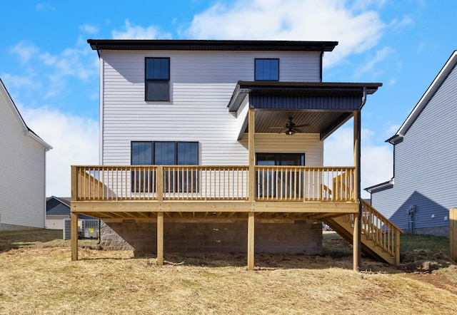 back of property with stairway, a deck, and cooling unit