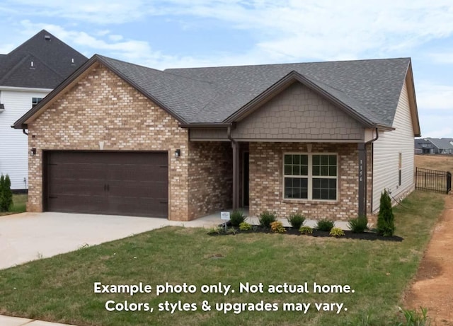 view of front of home featuring a garage and a front lawn