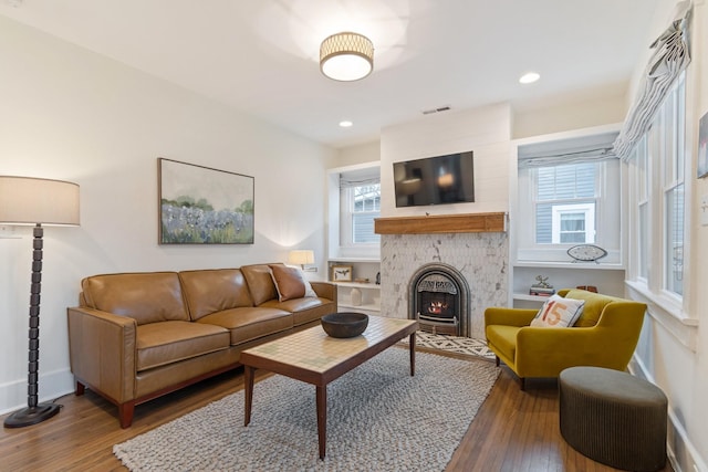 living room with dark hardwood / wood-style flooring