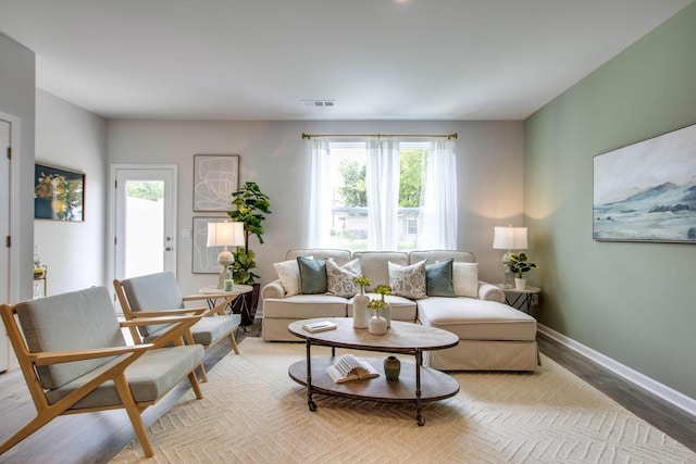 living room with light hardwood / wood-style floors