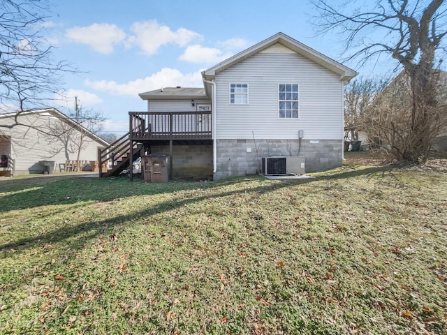 rear view of property with central AC unit, a yard, and a deck