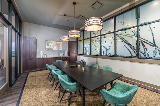 dining space with dark wood-type flooring