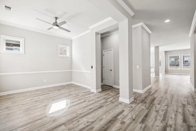 empty room featuring ceiling fan, ornamental molding, and light hardwood / wood-style floors