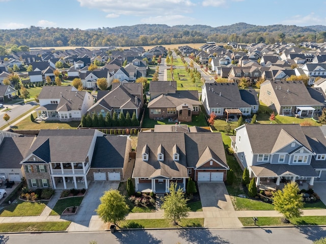 birds eye view of property with a mountain view