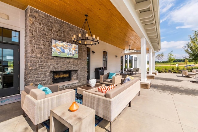 view of patio / terrace featuring an outdoor living space with a fireplace