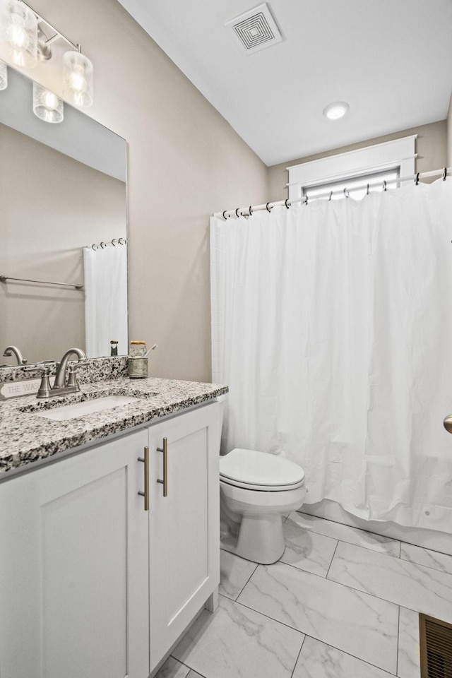 full bathroom with vanity, toilet, and shower / bath combo with shower curtain