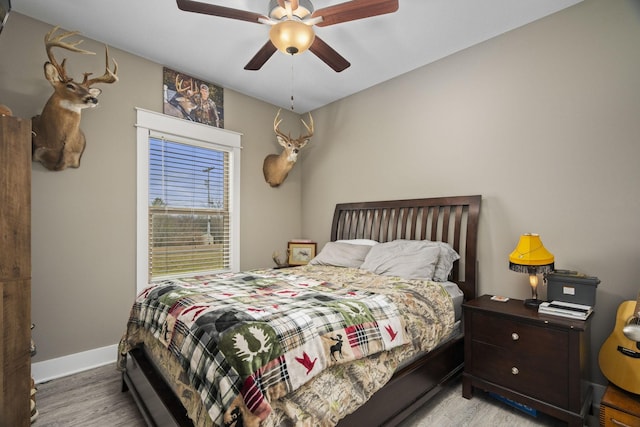 bedroom featuring ceiling fan and light hardwood / wood-style flooring