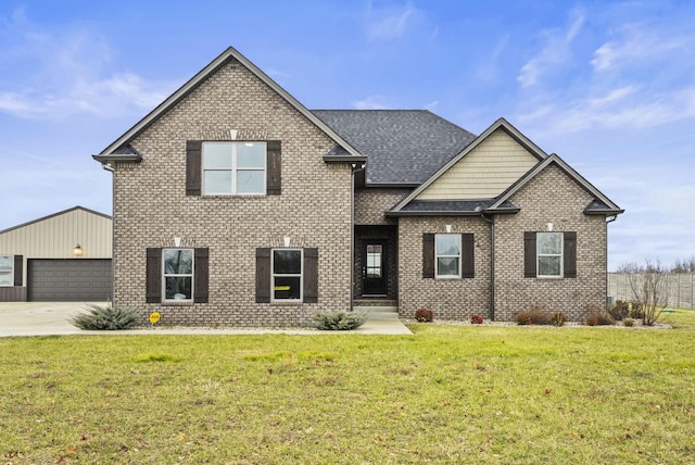 view of front of property with a garage and a front yard