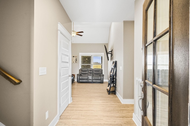 hall with light wood-type flooring