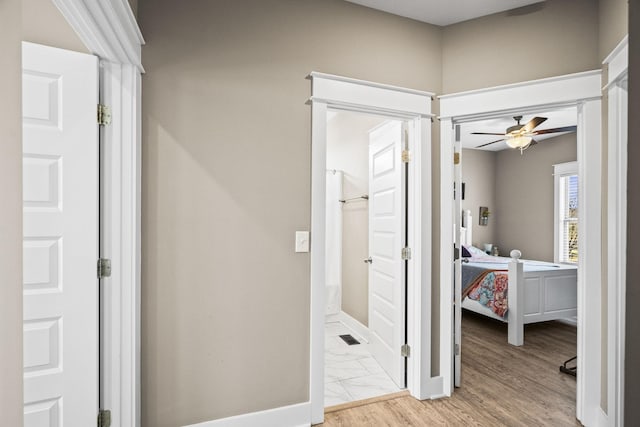 bathroom featuring hardwood / wood-style floors and ceiling fan