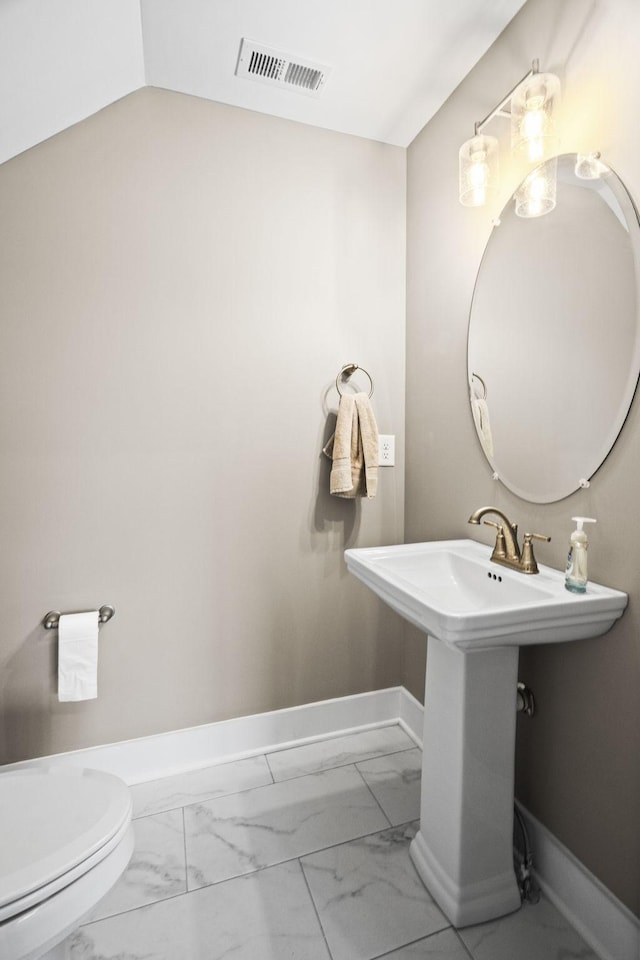 bathroom featuring sink and toilet