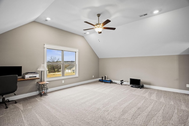 home office with vaulted ceiling, ceiling fan, and carpet floors