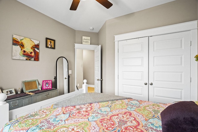 bedroom with ceiling fan and a closet