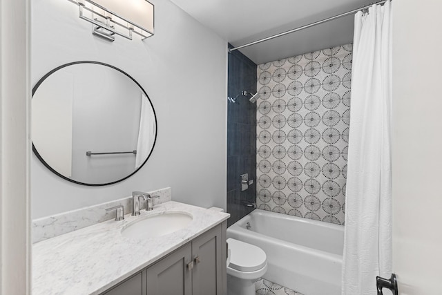 full bathroom with vanity, shower / tub combo, and toilet