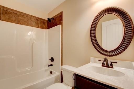 full bathroom with shower / tub combination, vanity, and toilet