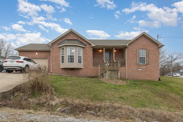 view of front of property with a garage and a front yard