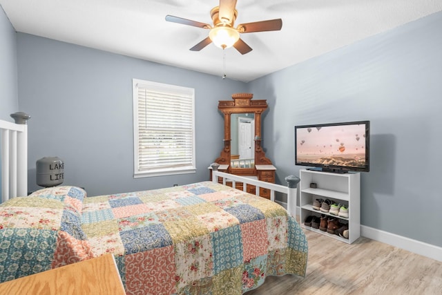 bedroom featuring ceiling fan and light wood-type flooring