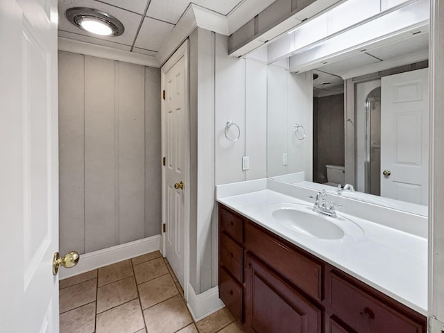 3556 Forest Park Rd, Springfield, TN 37172 - bathroom featuring toilet, vanity, baseboards, tile patterned floors, and a decorative wall