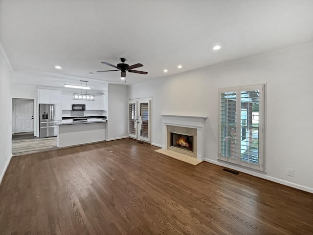 3556 Forest Park Rd, Springfield, TN 37172 - unfurnished living room with a high end fireplace, baseboards, a ceiling fan, dark wood-style flooring, and recessed lighting