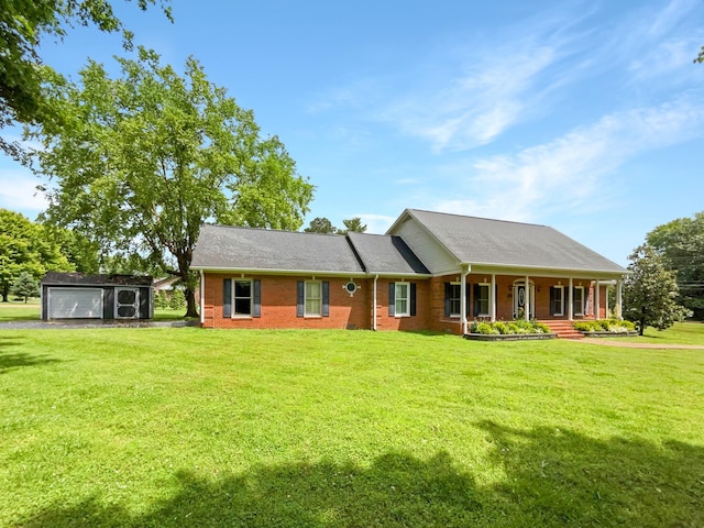 3556 Forest Park Rd, Springfield, TN 37172 - ranch-style home with an outbuilding, a porch, a garage, a front lawn, and brick siding