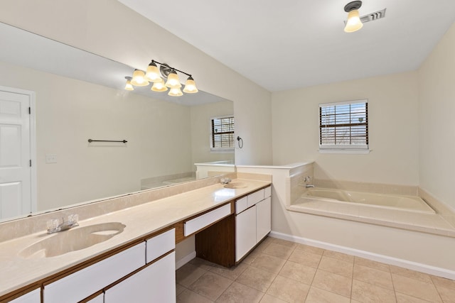 bathroom with vanity, a tub, and tile patterned floors