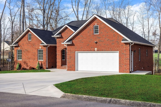 front facade featuring a garage and a front lawn